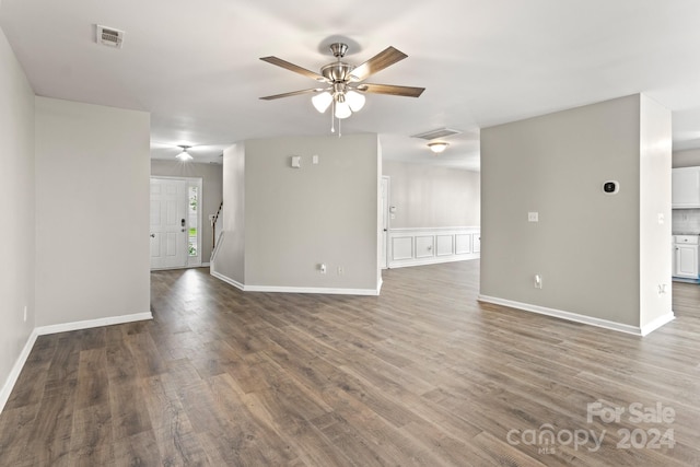 unfurnished room featuring ceiling fan and dark hardwood / wood-style flooring