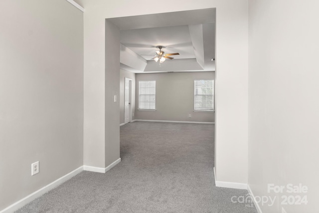 carpeted empty room with ceiling fan