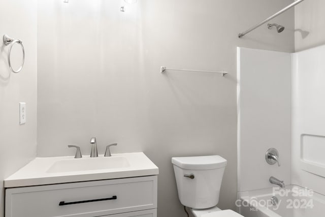 full bathroom featuring vanity, toilet, and  shower combination