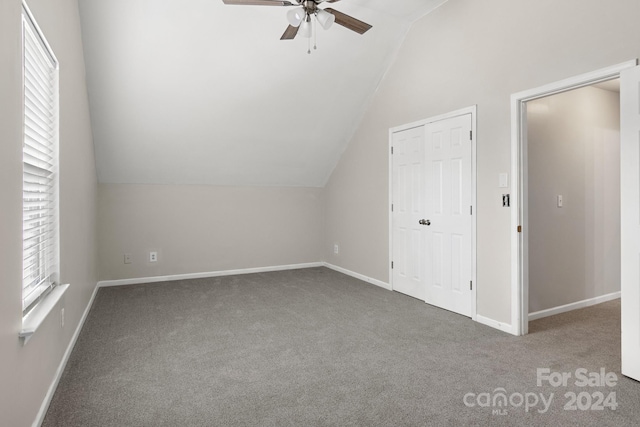 additional living space with lofted ceiling, ceiling fan, and carpet floors