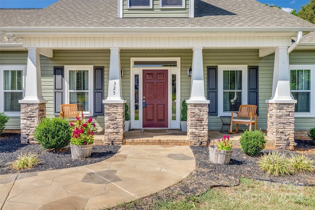 entrance to property featuring a porch