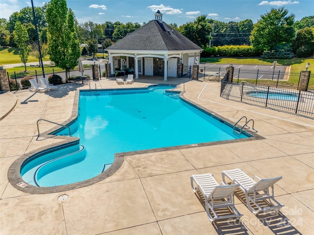 view of swimming pool featuring a patio