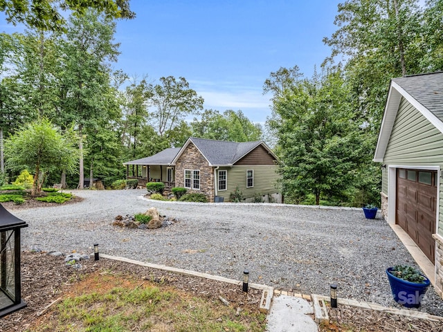 exterior space featuring a garage and a porch