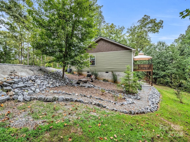 exterior space with a lawn and a deck