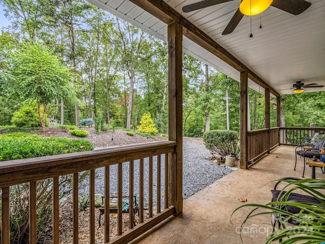 view of patio featuring ceiling fan and a porch