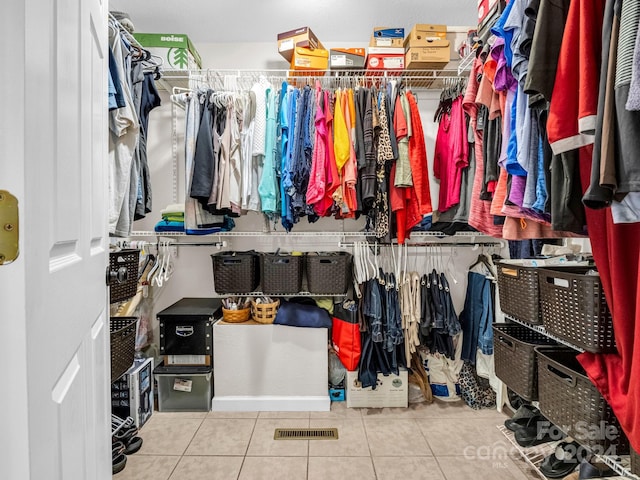 spacious closet featuring light tile patterned floors