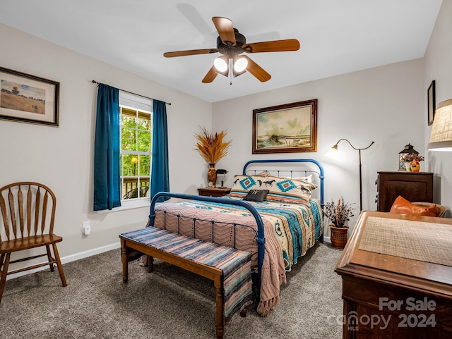 bedroom featuring ceiling fan and carpet