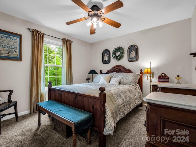 bedroom with ceiling fan and carpet