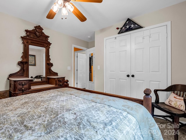 carpeted bedroom featuring a closet and ceiling fan