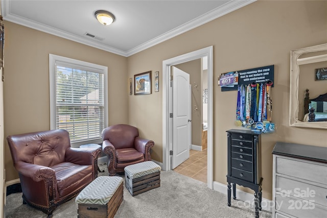 sitting room with light colored carpet and ornamental molding