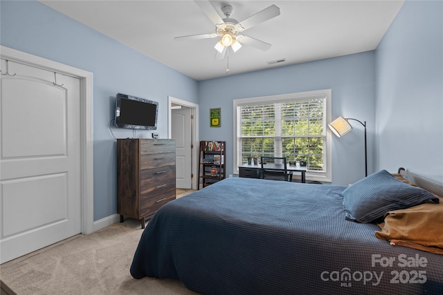 carpeted bedroom with ceiling fan