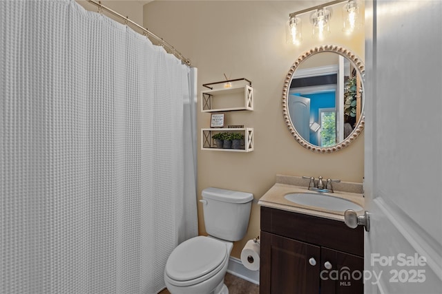 bathroom featuring vanity and toilet