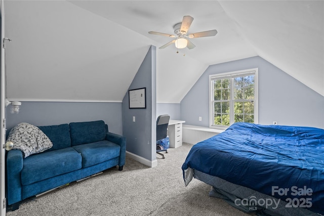 bedroom featuring ceiling fan, light colored carpet, and vaulted ceiling