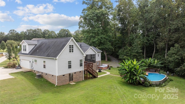 back of house with a lawn, central air condition unit, and a swimming pool side deck