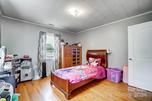 bedroom with light hardwood / wood-style flooring and ornamental molding