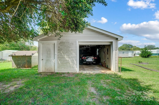 garage with a lawn