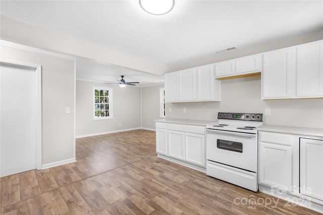 kitchen with light hardwood / wood-style flooring, ceiling fan, electric range, and white cabinetry