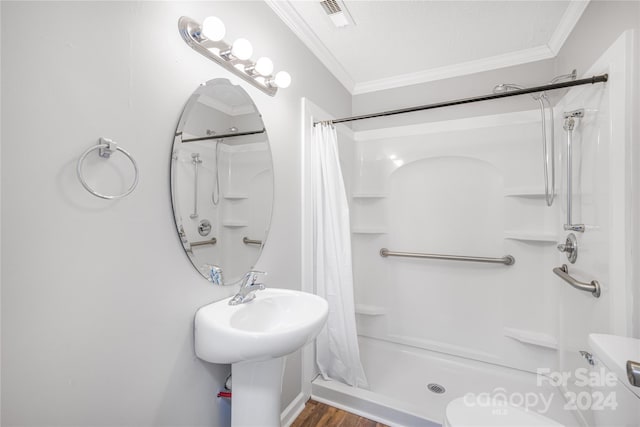 bathroom featuring walk in shower, toilet, crown molding, and wood-type flooring