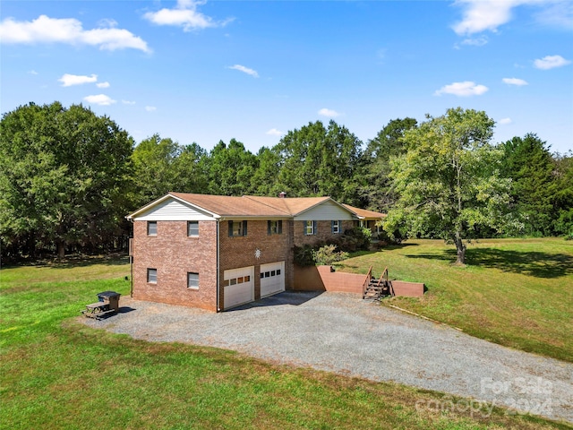 view of side of property with a lawn and a garage