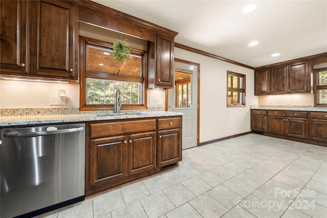 kitchen featuring light stone counters, dishwasher, crown molding, and sink