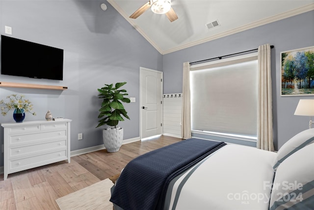 bedroom with ceiling fan, light hardwood / wood-style flooring, vaulted ceiling, and ornamental molding