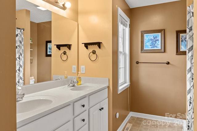 bathroom with toilet, tile patterned flooring, vanity, a textured ceiling, and curtained shower