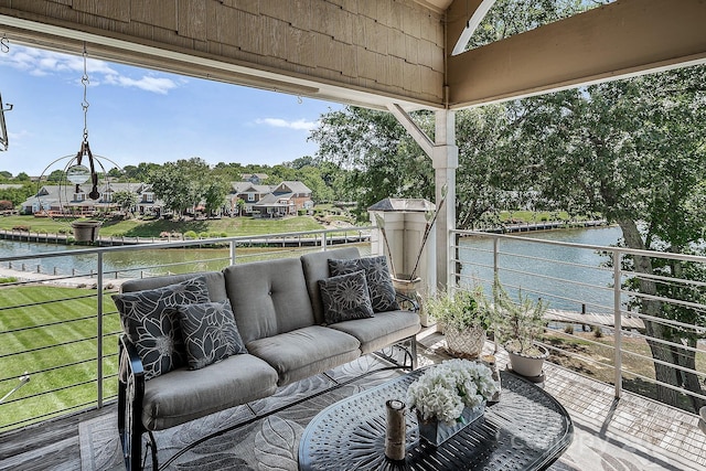 exterior space with a balcony and a water view