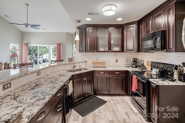 kitchen with light wood-type flooring, black appliances, ceiling fan, and decorative backsplash