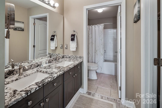 full bathroom with vanity, toilet, tile patterned flooring, and shower / bathtub combination with curtain