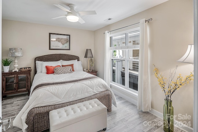 bedroom featuring light hardwood / wood-style flooring and ceiling fan