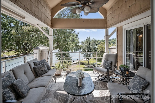 view of patio with a balcony and ceiling fan