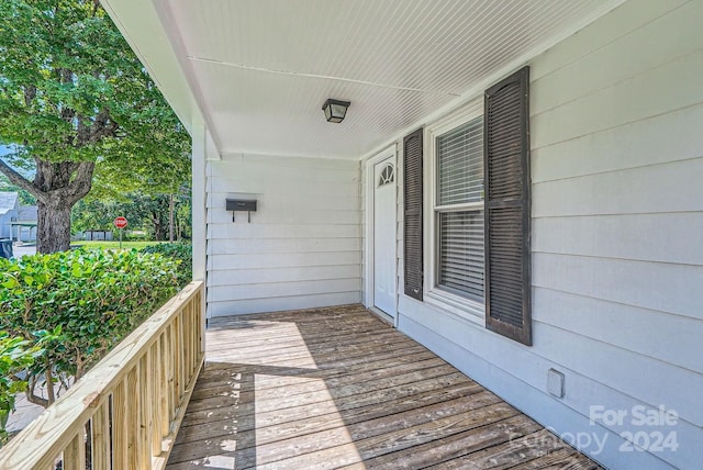 wooden deck featuring covered porch