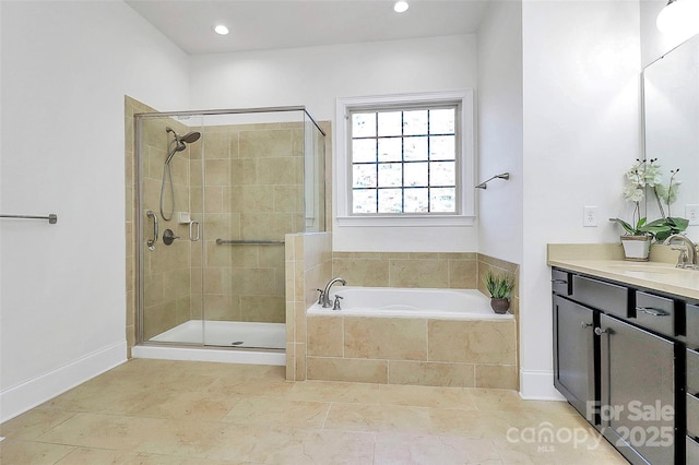 bathroom with vanity, tile patterned flooring, and shower with separate bathtub