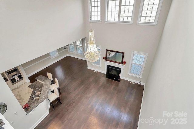 living room featuring dark wood-type flooring and sink