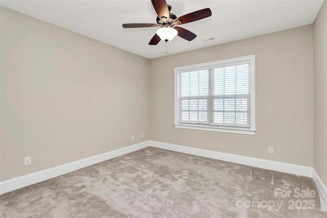 unfurnished room with ceiling fan and light colored carpet