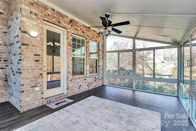 unfurnished sunroom featuring vaulted ceiling and ceiling fan