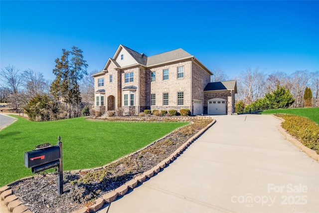 view of front of home featuring an attached garage, brick siding, driveway, stone siding, and a front lawn