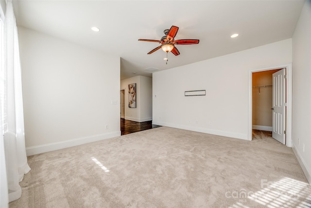 unfurnished room featuring a ceiling fan, carpet, baseboards, and recessed lighting