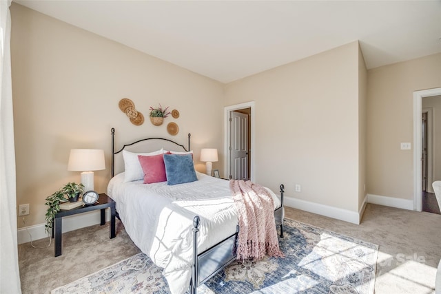 carpeted bedroom with baseboards