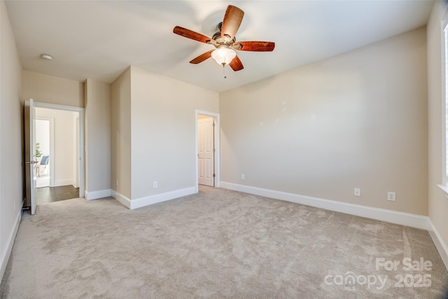 unfurnished bedroom featuring ceiling fan, carpet floors, and baseboards