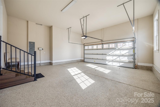 garage featuring baseboards and a garage door opener