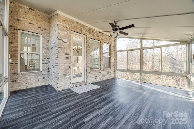 unfurnished sunroom featuring ceiling fan