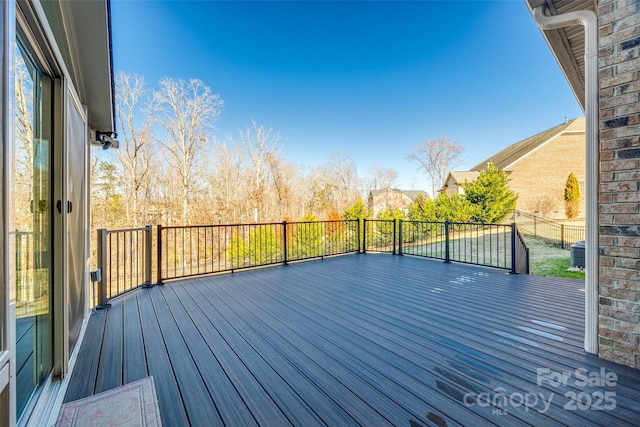 wooden deck with central air condition unit