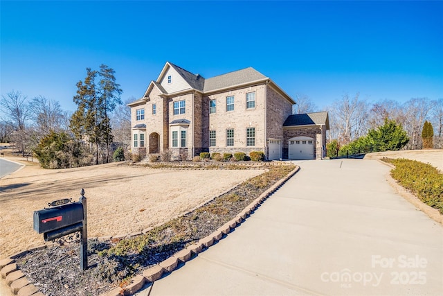 view of front of house with stone siding, concrete driveway, brick siding, and a garage