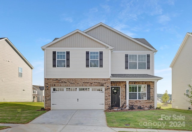 craftsman-style house with a front yard and a garage