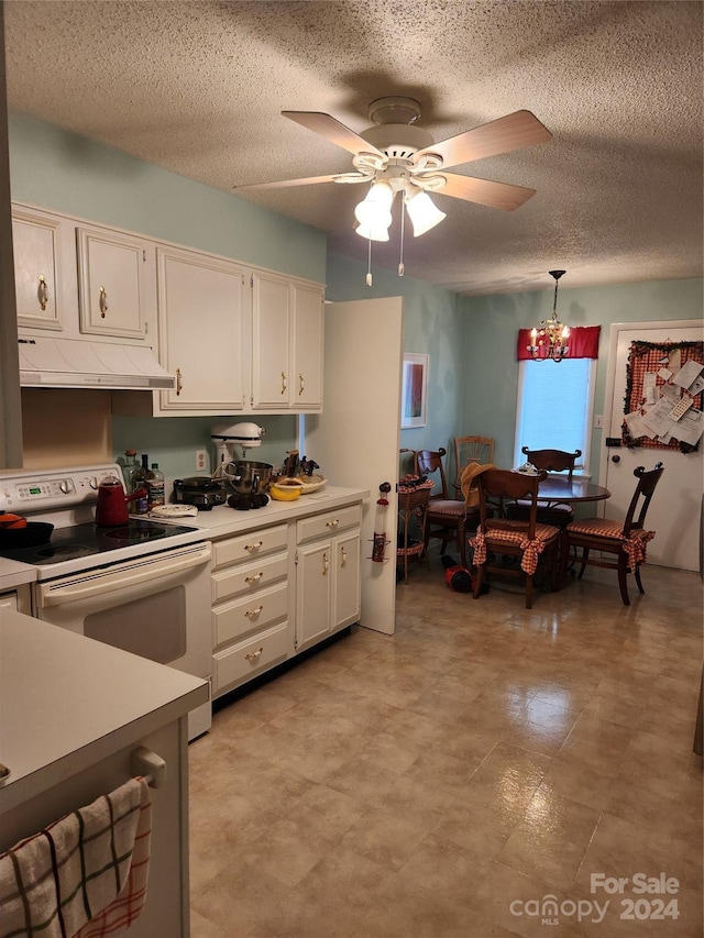 kitchen with white cabinets, ceiling fan, a textured ceiling, pendant lighting, and white range with electric stovetop