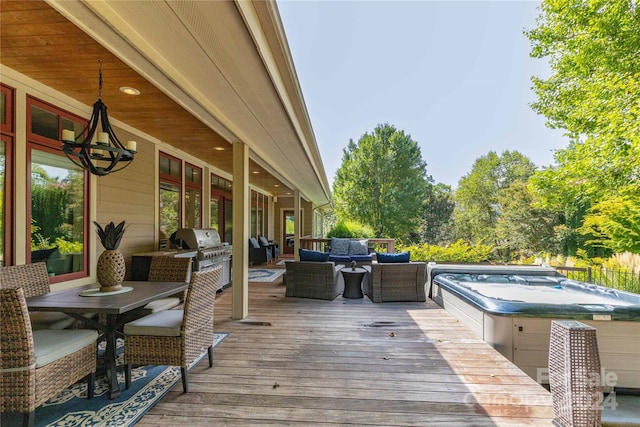 wooden terrace featuring an outdoor hangout area, area for grilling, and an outdoor hot tub