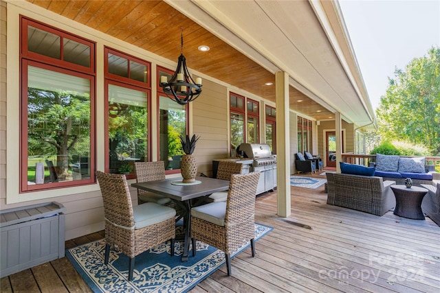 deck featuring an outdoor living space and a grill