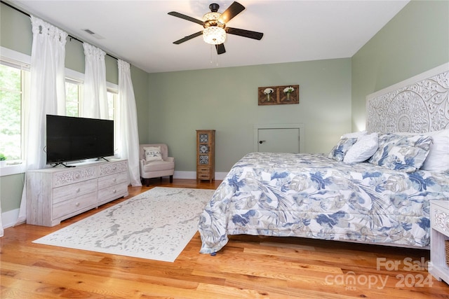 bedroom featuring hardwood / wood-style floors and ceiling fan