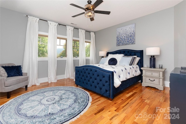 bedroom featuring ceiling fan and light hardwood / wood-style flooring